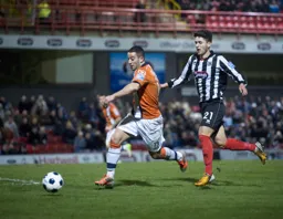 Stuart Fleetwood gets away from Andi Thanoj