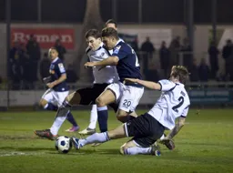 Scott Neilson is tackled by Richard Rose