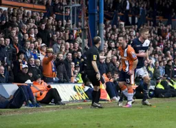 Stuart Fleetwood vents his anger at the assistant referee. The fan in the boater is not to pleased either