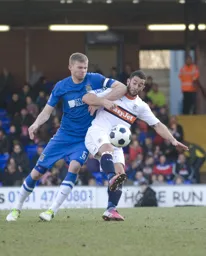 Stuart Fleetwood takes an elbow in the face from James Tunnicliffe