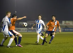 Stuart Fleetwood holds the ball up with Jonathan Smith in support