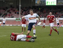 Dave Martin is stopped by a grounded Chris Westwood