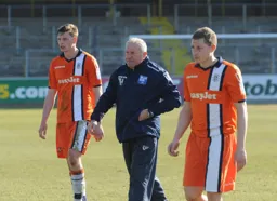 Assistant Manager Terry Harris looks far from happy. Jake Goodman and Dave Martin have a chastened look