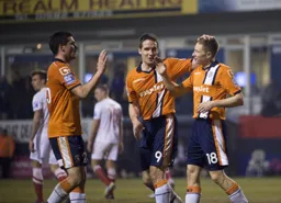 Ronnie Henry and Jon Shaw congratulate Dave Martin after he had made the score 3-0
