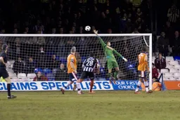 Dean Brill tips a shot over the bar