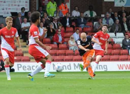 Luke Guttridge shoots at goal