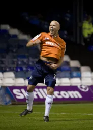 Luke Guttridge rejoices after scoring the second