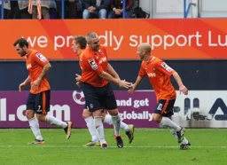Steve McNulty congratulates Luke Guttridge after his free kick made it 2-2