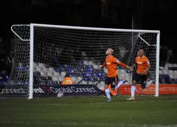 Luke Guttridge celebrates scoring the third