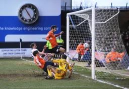 Alex Lawless gets there first to tap in the seventh
