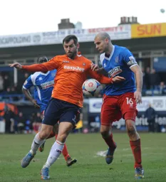 Alex Lawless holds off his man