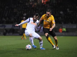 Alex Lawless holding off his man