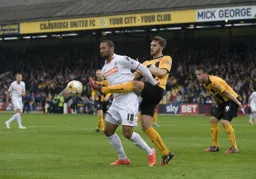 Ross Lafayette holds off a defender