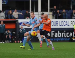 Luke Guttridge beats his man
