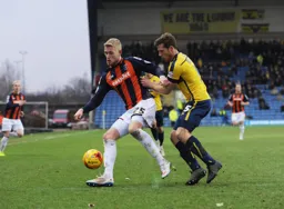 Jayden Stockley holds off the defender