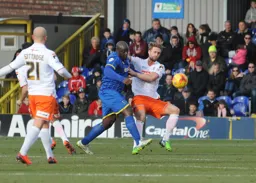 Franks Franks tussles with Adebayo Akinfenwa