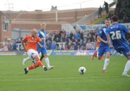 Luke Guttridge tries a shot from long distance