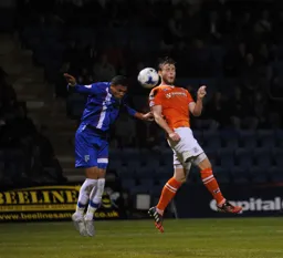 Mark O`Brien challenges for the ball