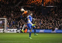 Luke Wilkinson gets above future Hatter Ollie Palmer