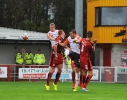 Scott Griffiths and Luke Wilkinson combine to clear the ball