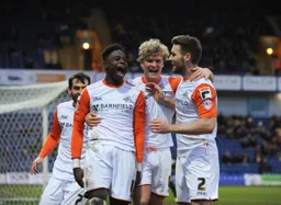 Pelly-Ruddock Mpanzu celebrates scoring the second goal with Cameron McGeehan and Stephen O`Donnell