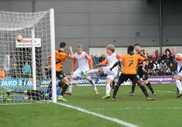 Cameron McGeehan slams the ball into the net to put Town on level terms