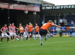 Cameron McGeehan`s free kick found its way into the net for Town`s first goal