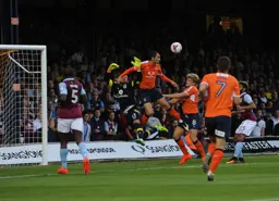 Danny Hylton makes life uncomfortable for Mark Bunn