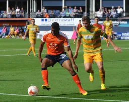 Isaac Vassell controls the ball