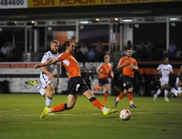 Danny Hylton is at full stretch to reach the ball