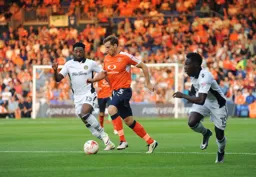 Johnny Mullins goes on a forward run with the ball