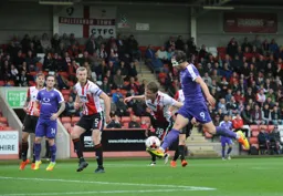 The ball appears to be stuck to Danny Hylton`s foot