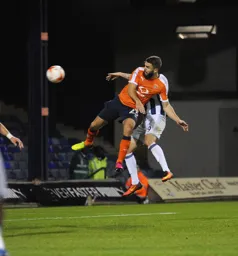 Josh McQuoid wins the header