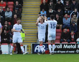 High fives for Cameron McGeehan after scoring his goal with Alex Gilliead