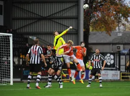 Adam Collin punches the ball away from Cameron McGeehan and Danny Hylton