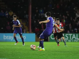 Danny Hylton scores from the penalty spot for the second time in the game