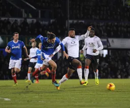Isaac Vassell is determined to get the ball first