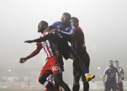 Isaac Vassell battling hard for a header