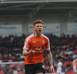 Jordan Cook shows his delight after his goal put the Town into the lead