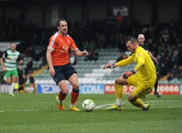 Danny Hylton goes around Artur Krysiak and scores his and Town`s second goal