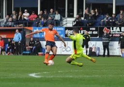 Isaac Vassell tries to round the keeper