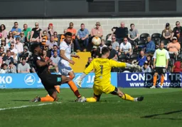 Isaac Vassell goes for goal