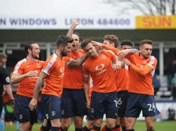 Celebrating Danny Hylton`s opener looks a bit painful for Olly Lee
