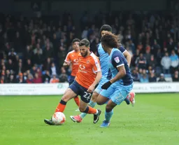 Luke Gambin rounds his man