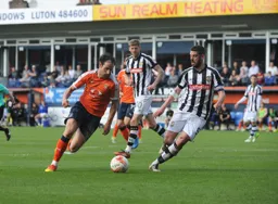 Danny Hylton goes past Richard Duffy