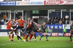Glen Rea powers a header towards goal