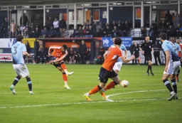 Isaac Vassell tries at shot from twenty five yards