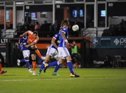 James Collins tries a shot from distance