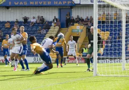 Danny Hylton bravely dives in to head in Town`s second goal