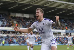 James Collins celebrates his stoppage time winner